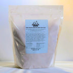 Bag of free-range grass-fed beef dog food with a label on a white background